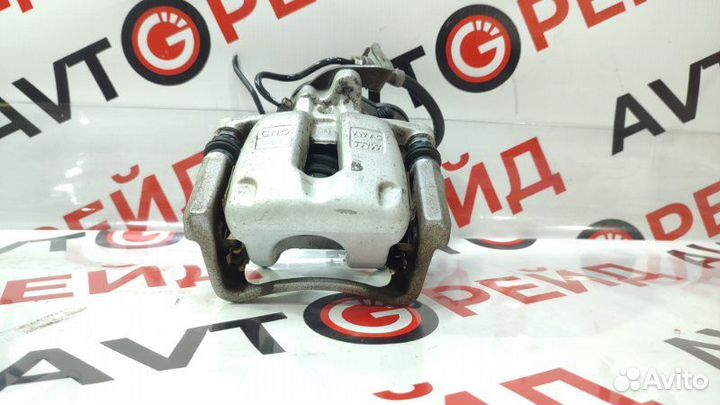 Суппорт тормозной задний левый Volkswagen Passat