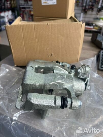 Суппорт тормозной задний левый киа rio / солярис