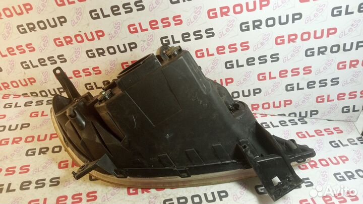 Фара головная DY L не рест б/у (черные очки) Demio