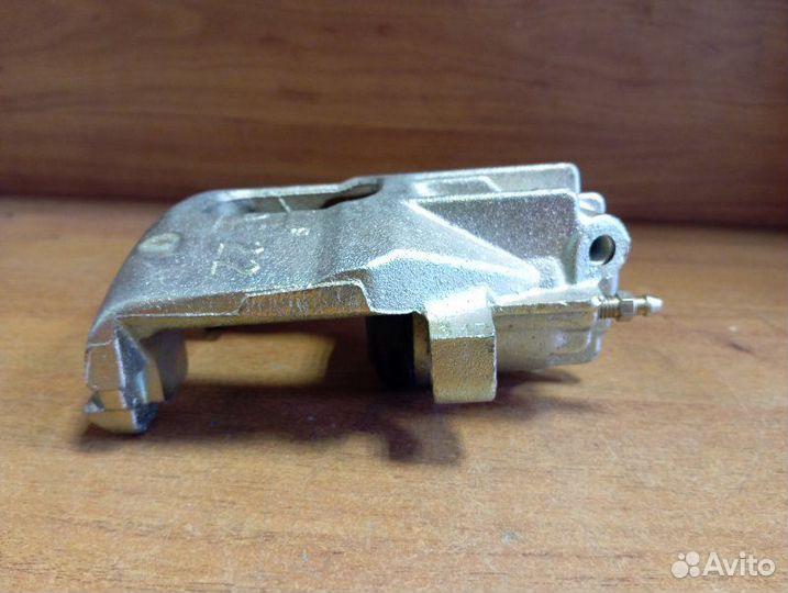 Суппорт тормозной передний левый Ford Focus I