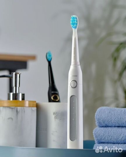 Электрическая зубная щетка