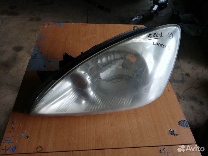 Фара передняя левая Mitsubishi Lancer 9