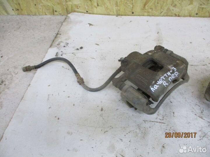 Суппорт передний Шевроле Лачетти