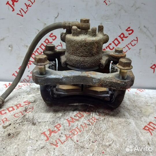 Суппорт тормозной передний Mitsubishi Lancer 9