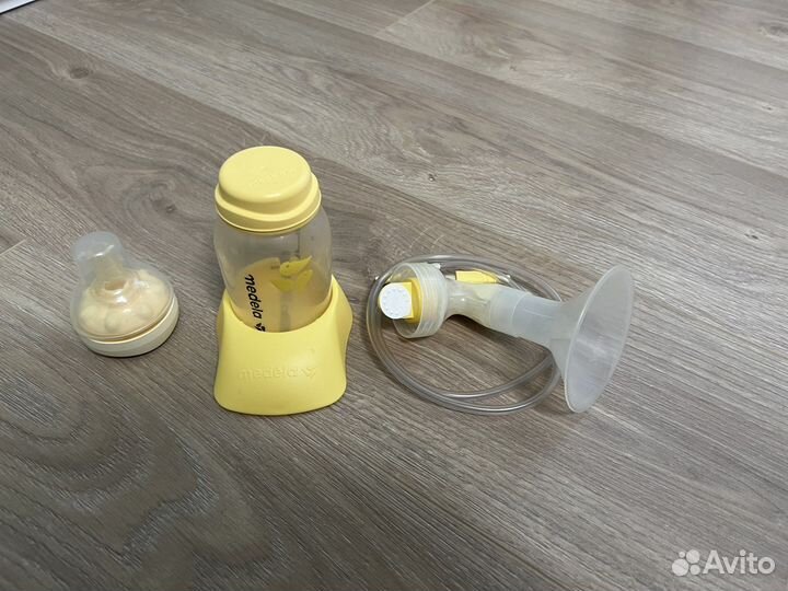 Молокоотсос medela электрический