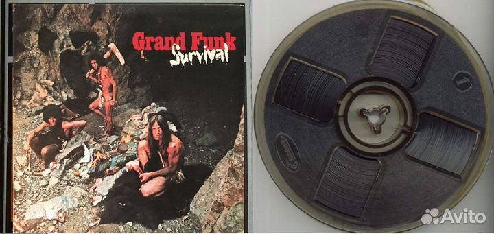 Магнитофонная катушка с записью