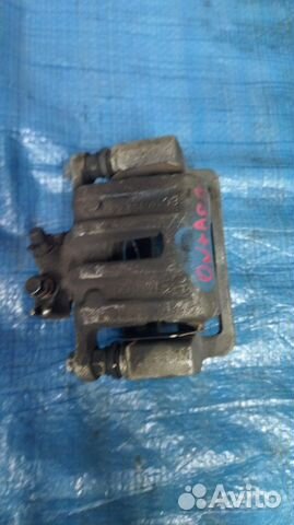 Суппорт тормозной задний левый Opel Antara