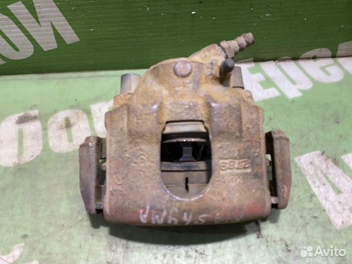 Суппорт тормозной передний левый Kia Shuma