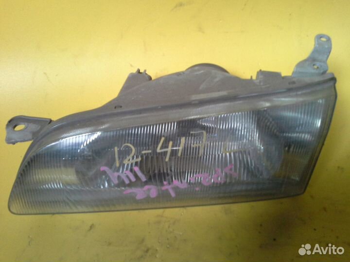 Фара левая Toyota Corolla Sprinter AE110