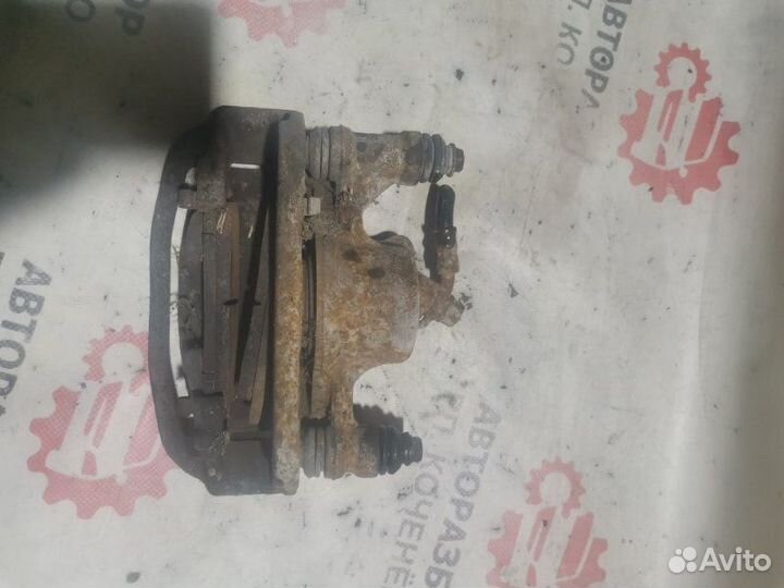 Суппорт тормозной передний левый Toyota Corolla