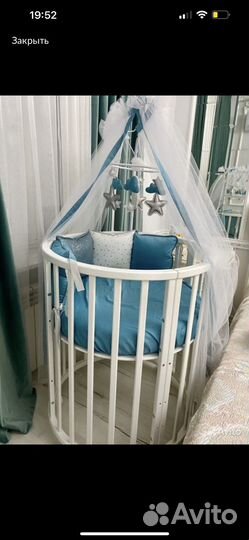 Детская кроватка с маятником