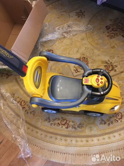 Детская машинка каталка музыкальная