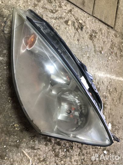 Передняя левая фара Volkswagen Passat B6