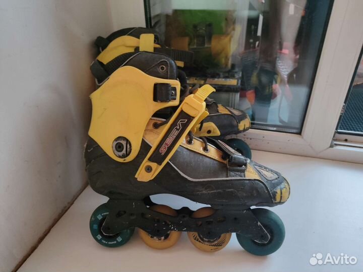 Роликовые коньки