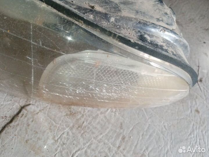 Фара передняя левая Dodge Caravan grand 3.3 1997