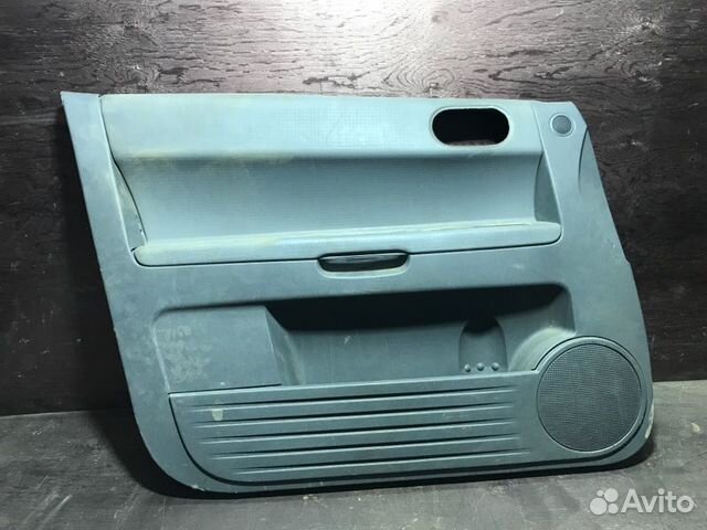 Обшивка боковой двери передняя левая Mitsubishi