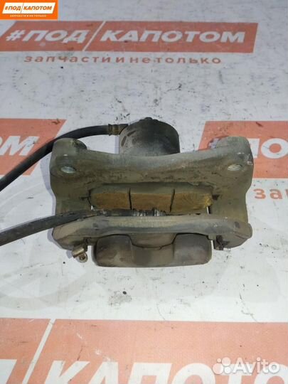 Суппорт тормозной передний левый Nissan Teana J32