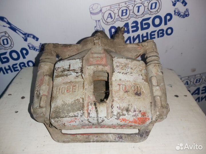 Суппорт тормозной левый Toyota Carina AT191