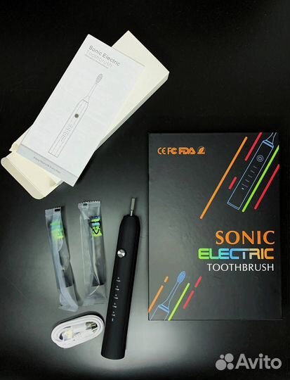 Электрическая зубная щетка