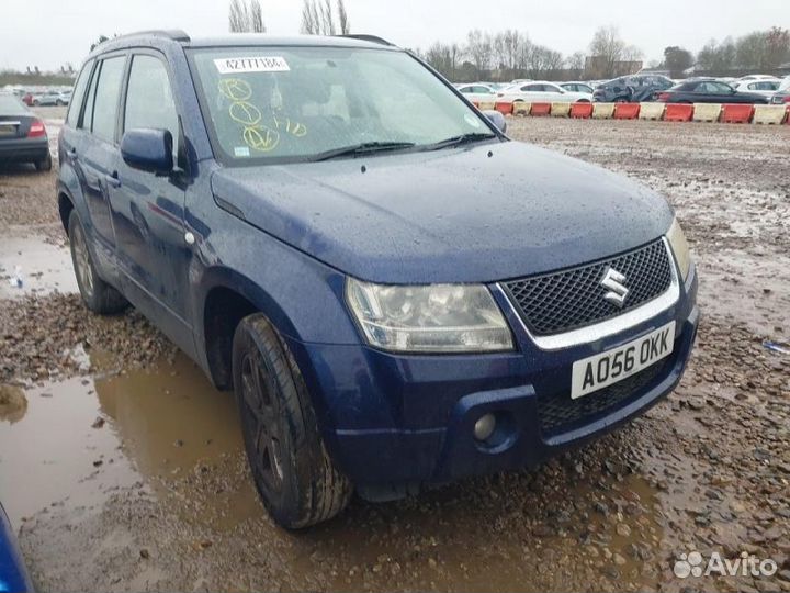 Замок двери передний левый Suzuki Grand Vitara