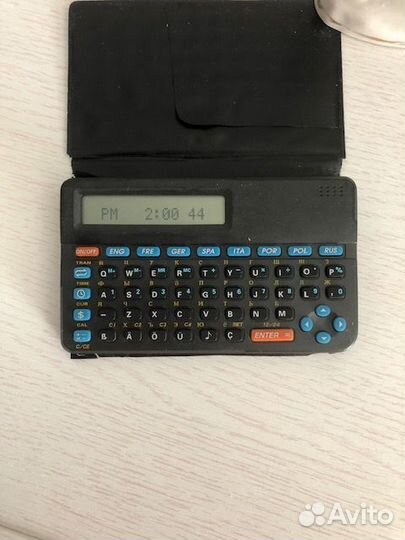 Электронный карманный калькулятор-переводчик.80-е