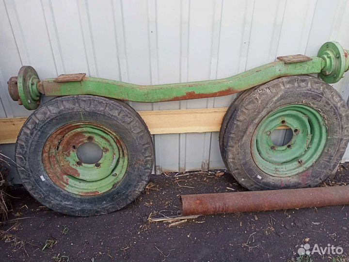 Ось с колесами