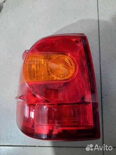 Фонарь наружный задний левый Тoyota Land Cruiser