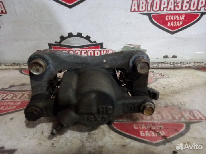 Суппорт тормозной задний левый Toyota Alphard