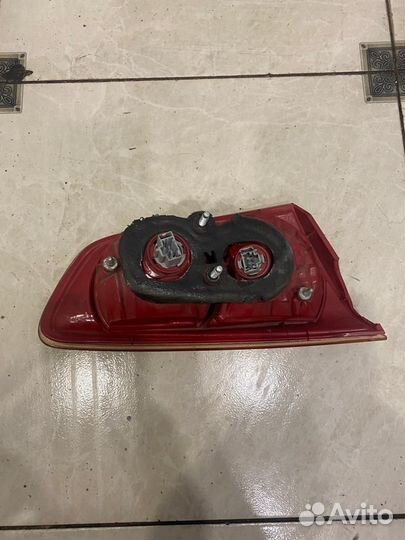 Фонарь задний левый (крышка багажника) Mitsubishi