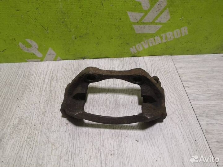 Скоба суппорта переднего Пежо 206