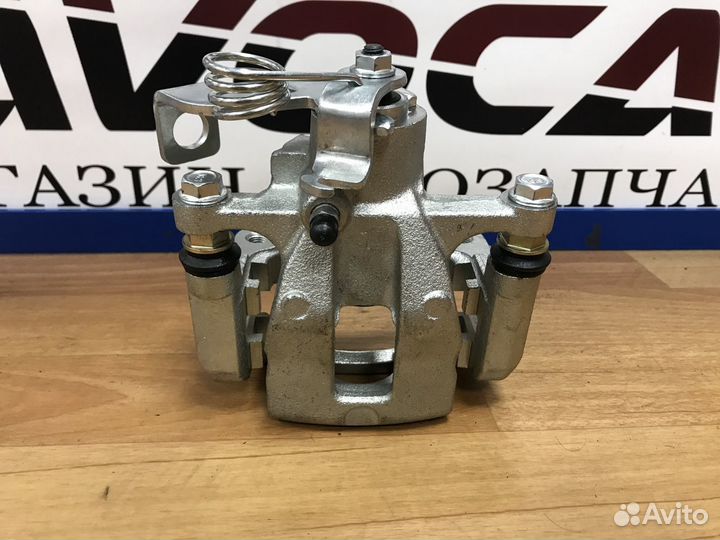 Суппорт тормозной задний левый Солярис 2010 2017