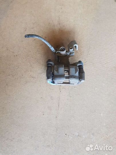 Суппорт тормозной задний правый Мазда 6GH