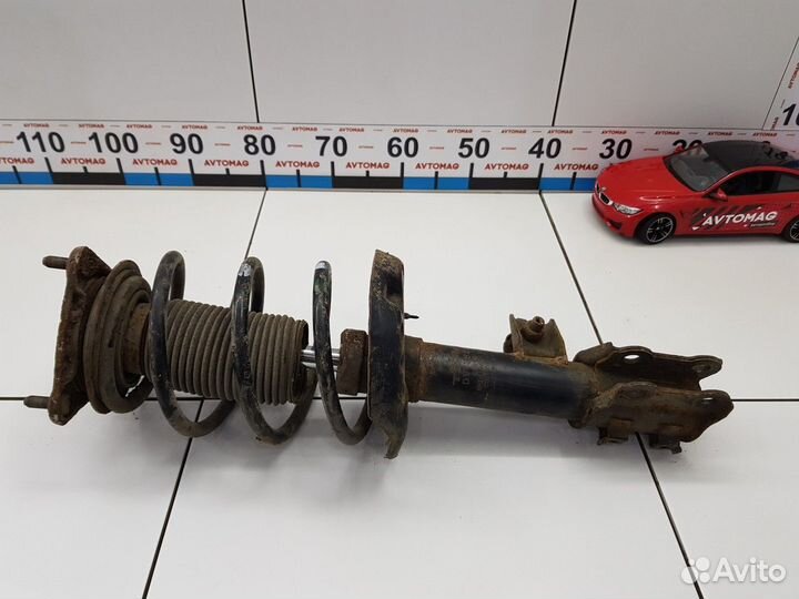 Амортизатор передний левый с пружиной