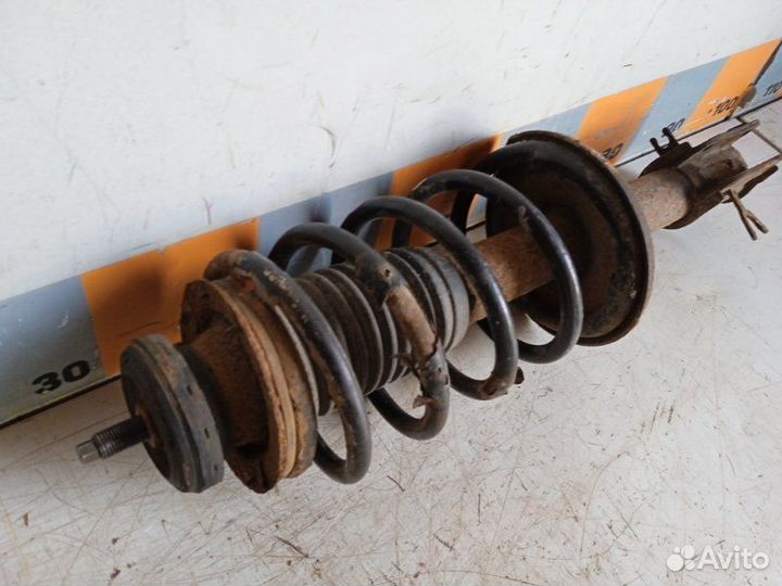 Амортизатор передний левый Chevrolet Aveo T250 1.2