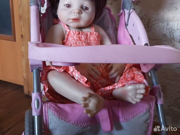 Кукла-реборн в коляске