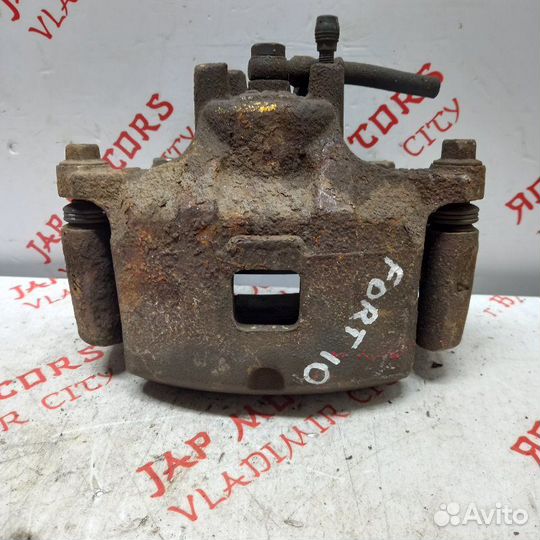 Суппорт тормозной передний левый Mitsubishi Lancer