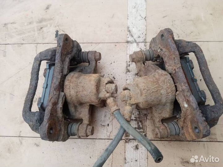 Суппорт тормозной задний Subaru Forester