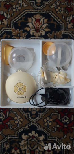 Молокоотсос medela электрический