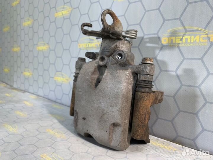 Суппорт тормозной задний левый Opel Insignia A