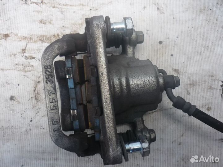 Суппорт тормозной задний LH/RH Nissan Teana L33