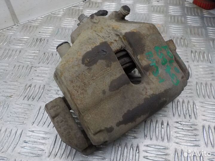 Суппорт тормозной передний левый на Volkswagen Pol