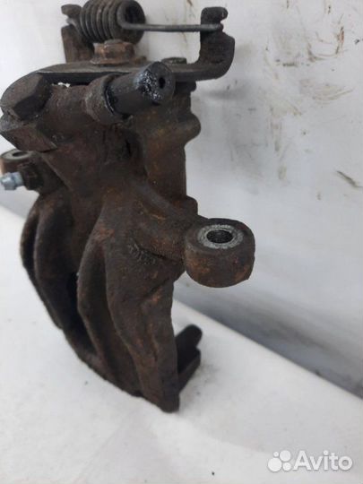 Суппорт тормозной задний левый Jaguar X-Type седан