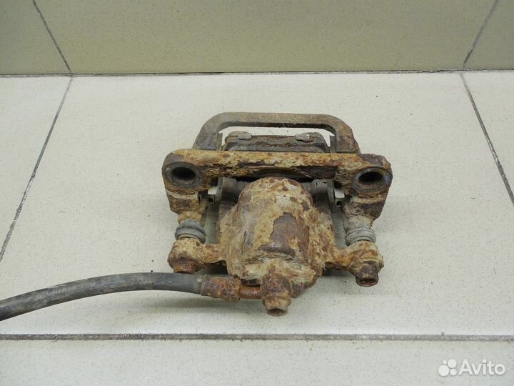 Суппорт задний левый X-Trail (T30) 2001-2006