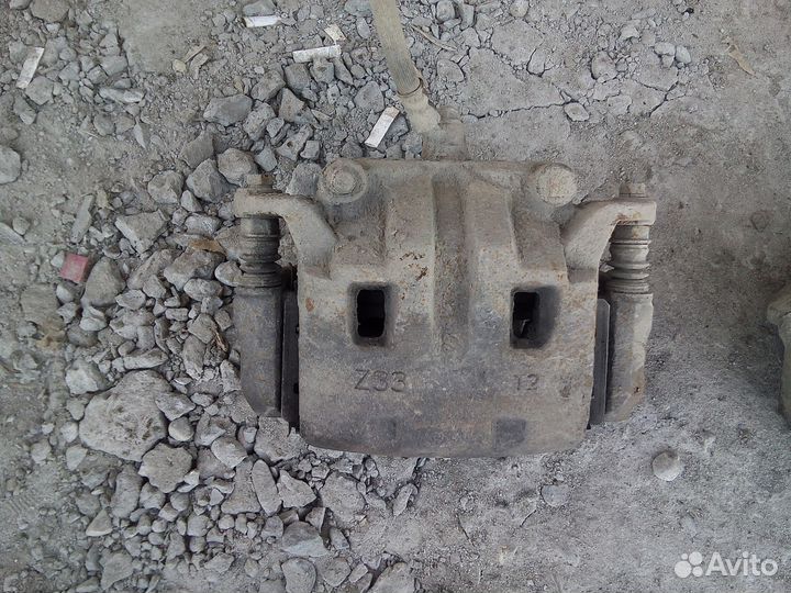 Суппорта передние Ниссан Навара Патфайндер