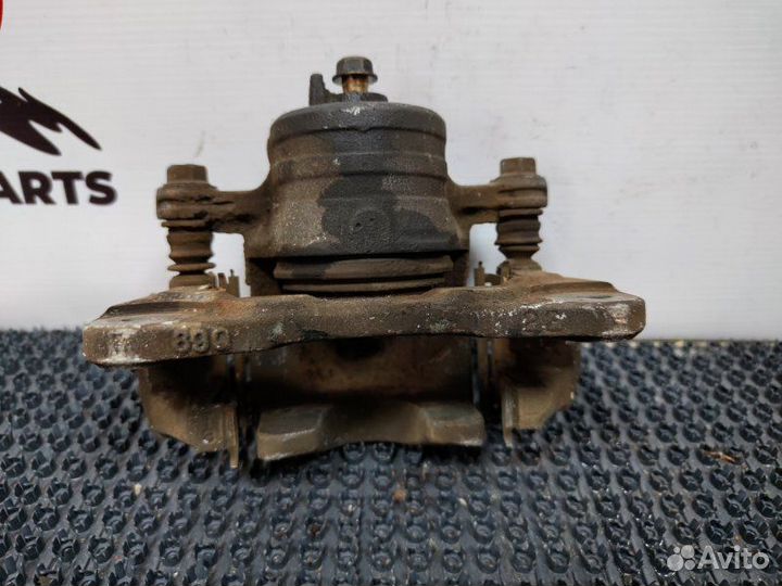 Суппорт тормозной передний левый Nissan Wingroad