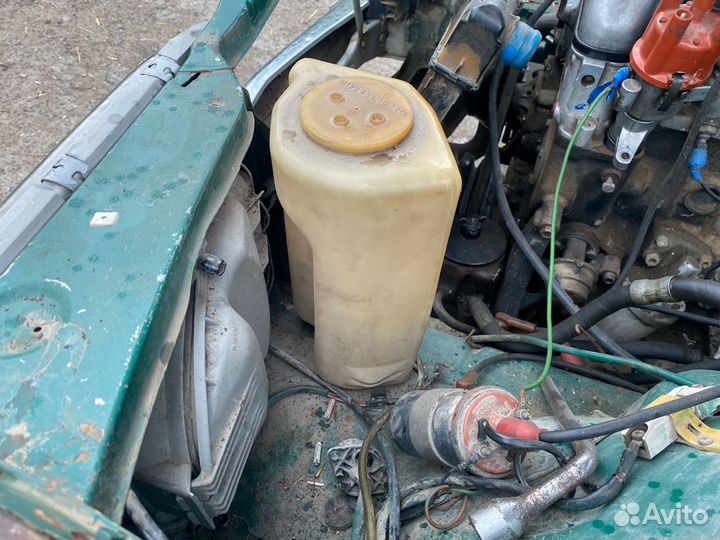 Бочок омывателя Mercedes W123