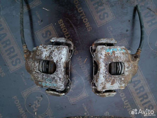 Суппорт тормозной передний левый Kia Shuma