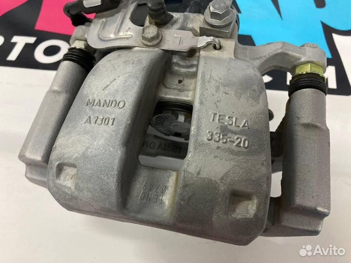 Суппорт тормозной задний левый Tesla Model 3