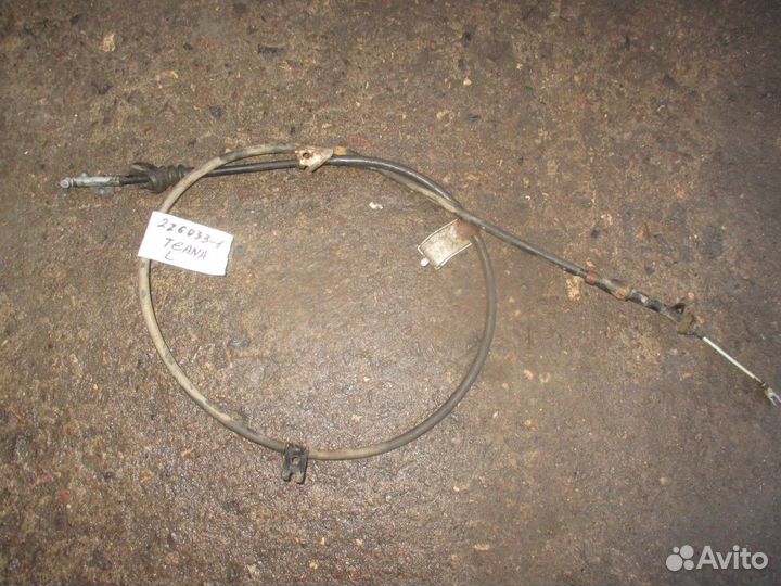 Трос стояночного тормоза левый (Nissan Teana)