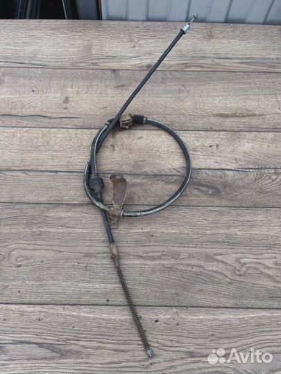 Трос ручного тормоза Mitsubishi Lancer 1.6
